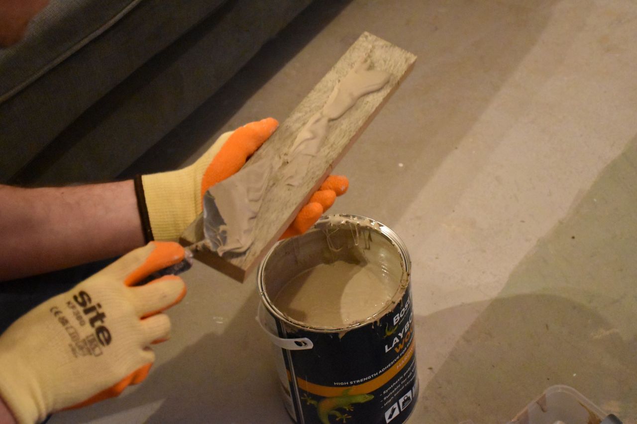 Putting the glue on the blocks to stick them down