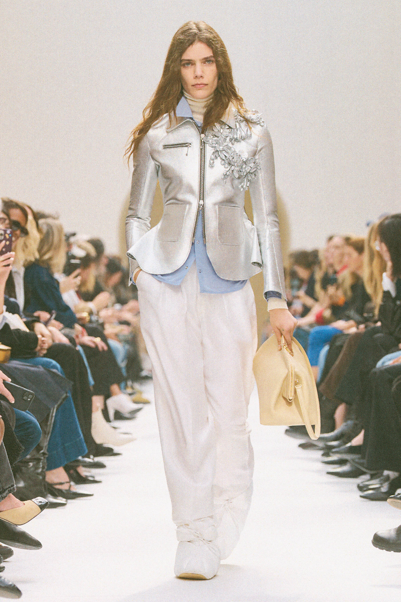 Fall/winter 2026 runway look featuring the everyday clutch handbag trend.