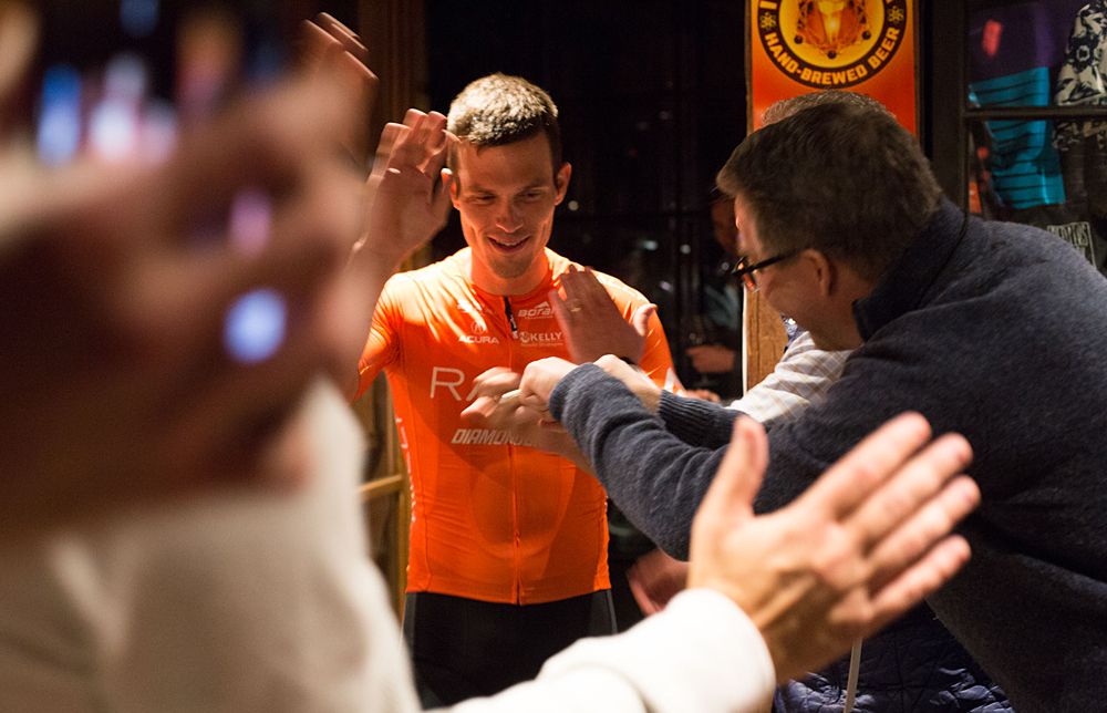 Evan Huffman on stage at the Rally Cycling team launch