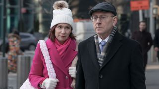 From left to right: Carrie Preston walking right behind Michael Emerson on Elsbeth. 