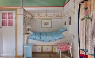 blue Magniberg bedding on bed in alcove