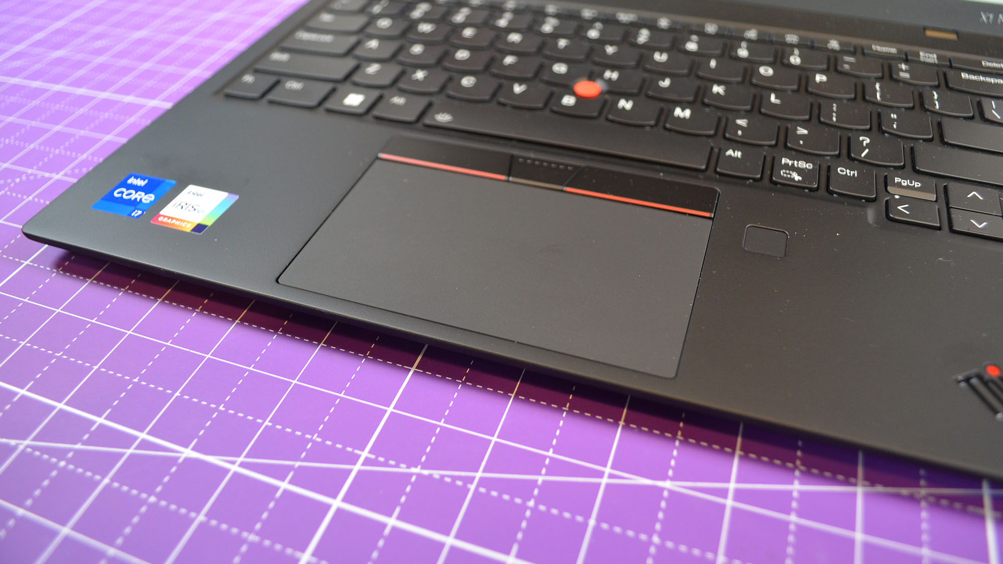 A Lenovo ThinkPad X1 Nano Gen 3 on a desk with a purple desk mat