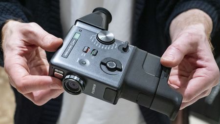 Fujifilm Instax Mini Evo Cinema camera in user's hands
