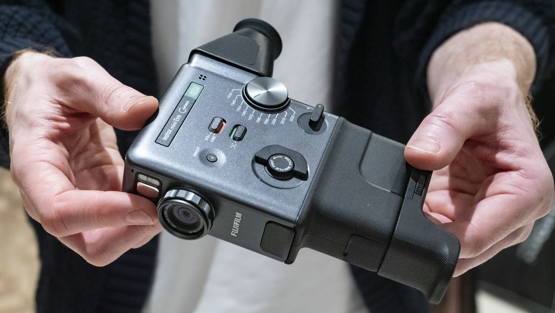 Fujifilm Instax Mini Evo Cinema camera in user's hands