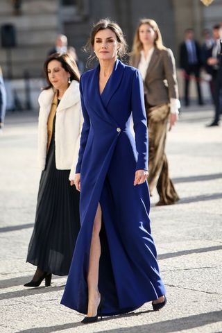 Queen Letizia wearing a dark blue coat dress
