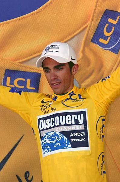 His first trip onto the leader's podium Alberto Contador waves