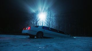 A limo sinks into a frozen lake