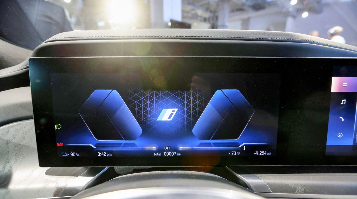Close-up of cluster display behind steering wheel