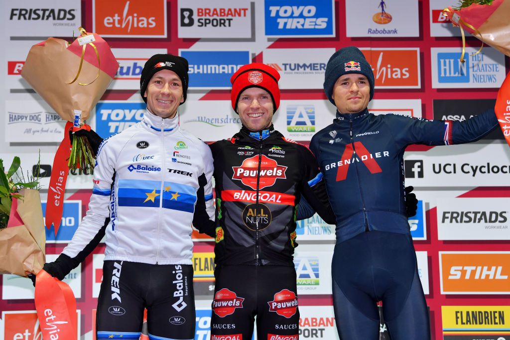 HOOGERHEIDE NETHERLANDS JANUARY 23 LR Lars Van Der Haar of Netherlands and Team Baloise Trek Lions on second place stage winner Eli Iserbyt of Belgium and Team Pauwels Sauzen Bingoal and Thomas Pidcock of The United Kingdom and Team INEOS Grenadiers on third place pose on the podium during the podium ceremony after the 32nd GP Adrie Van der Poel Hoogerheide UCI CycloCross Worldcup 2022 Mens Elite CXWorldCup on January 23 2022 in Hoogerheide Netherlands Photo by Luc ClaessenGetty Images