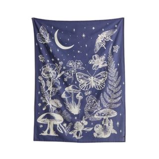 A navy blue tapestry with mushroom and nature illustrations 