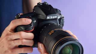 Person holding Nikon D810