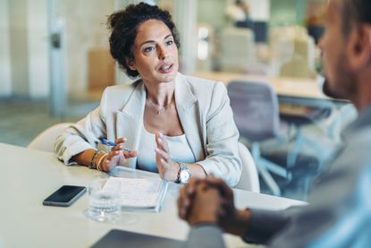 A financial adviser for retirementplanning meets with a client.