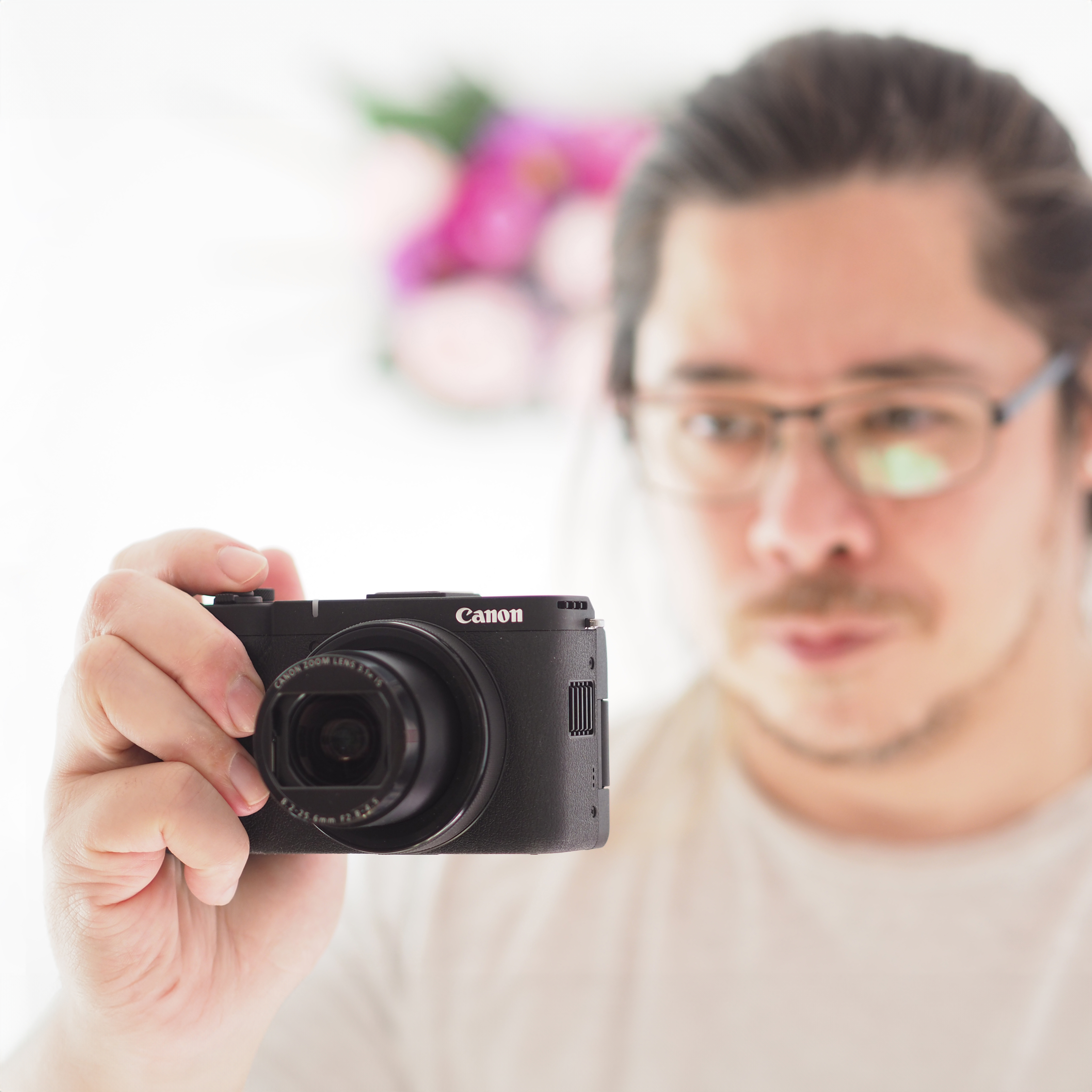 James Artaius holding a Canon PowerShot V1 camera
