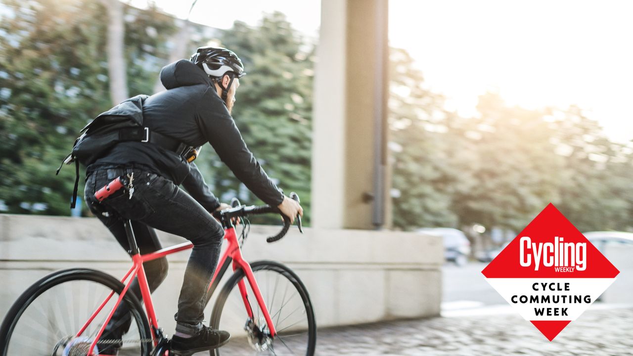 Male cyclist wearing and bringing all the commuting essentials he needs while cycling by bike to work.