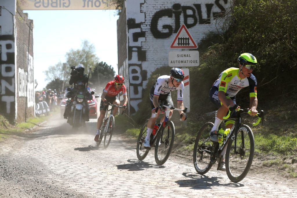 ROUBAIX FRANCE APRIL 17 LR Laurent Pichon of France and Team Arka Samsic Matej Mohoric of Slovenia and Team Bahrain Victorious and Tom Devriendt of Belgium and Team Intermarch Wanty Gobert Matriaux compete in the breakaway passing through a dusty cobblestones sector during the 119th ParisRoubaix 2022 Mens Elite a 2572km one day race from Compigne to Roubaix ParisRoubaix WorldTour on April 17 2022 in Roubaix France Photo by Bas CzerwinskiGetty Images