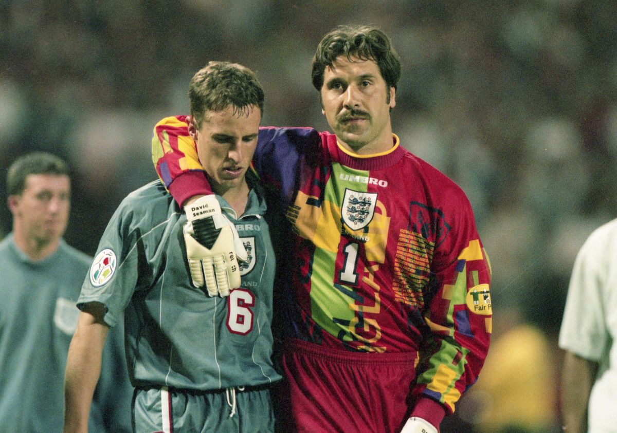 England's Gareth Southgate is consoled by teammate and goalkeeper David Seaman after missing the decisive penalty during the shootout against Germany in the Euro 96 semi-final