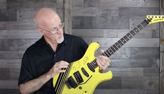 Tom Weber holding a signed Kramer Paul Dean gifted to him by Eddie Van Halen