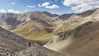 A hiker descending one of Colorados 14ers