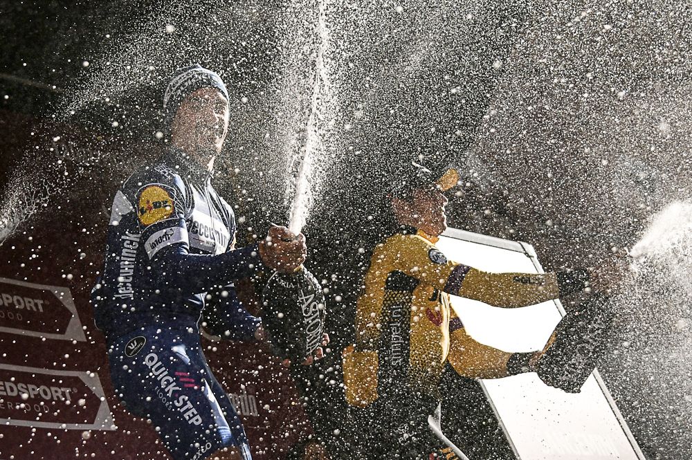 Julian Alaphlippe and Wout Van Aert celebrate on the Strade Bianche podium