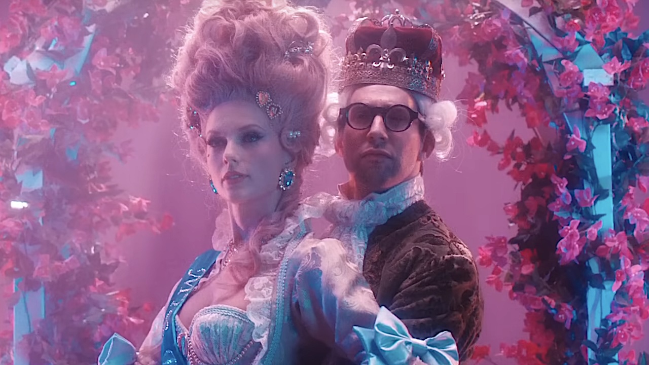 Taylor Swift and Jack Antonoff dressed like old European royalty in crowns and wigs for Swift&#039;s &quot;Bejeweled&quot; music video.