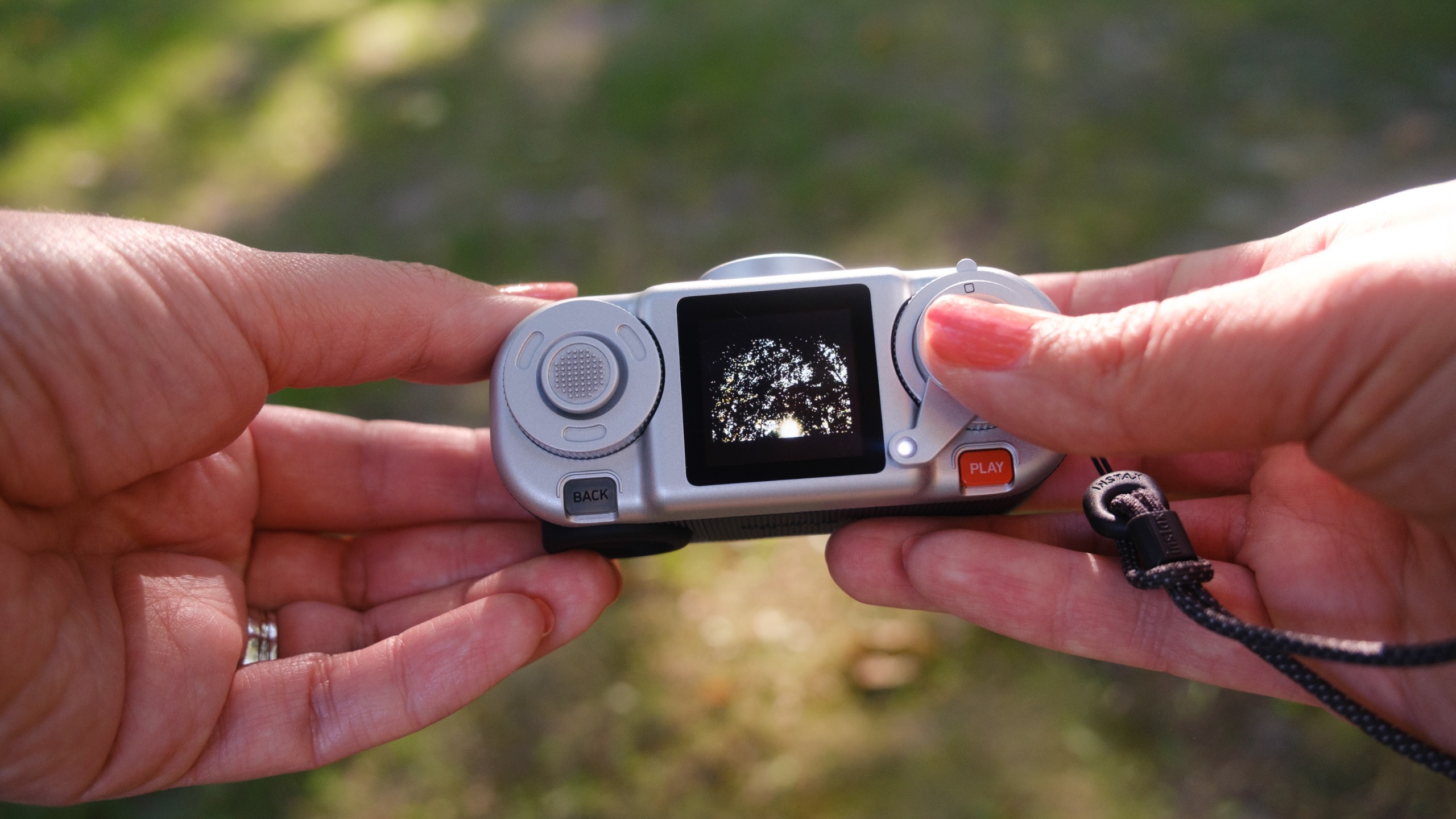 The Instax Pal 2 in a photographer's hands