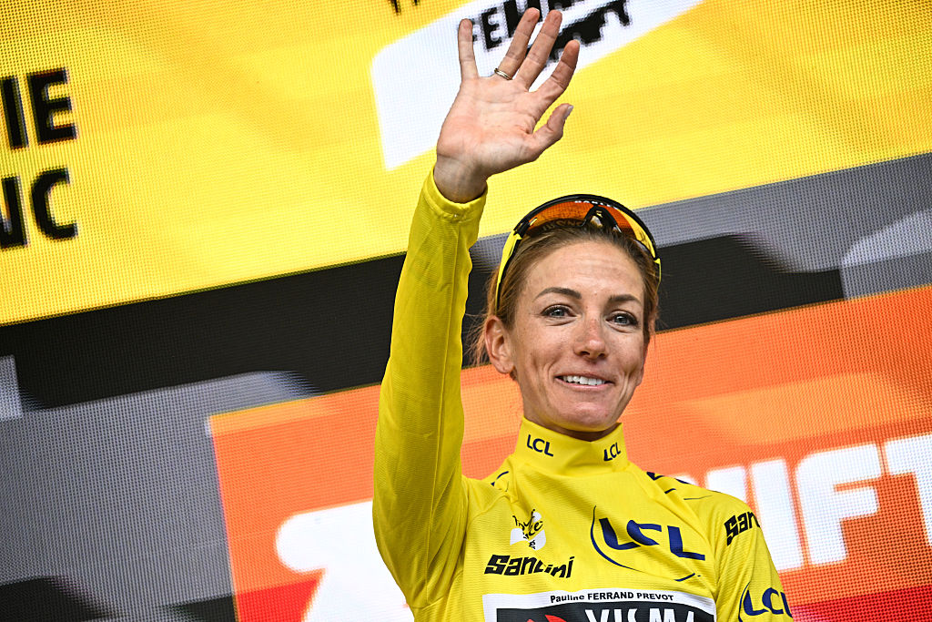 Team Visma | Lease a Bike&#039;s French rider Pauline Ferrand-Prevot celebrates with the overall leader&#039;s yellow jersey on the podium for the fourth edition of the Women&#039;s Tour de France cycling race at the end of the 9th and final stage (out of 9), 124.1 km from Praz-sur-Arly to Chatel, in Chatel eastern France, on August 3, 2025. (Photo by JULIEN DE ROSA / AFP)