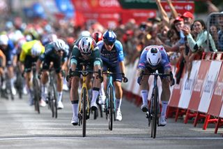 VILLABLINO SPAIN AUGUST 31 LR Wout van Aert of Belgium and Team Visma Lease a Bike Green Points Jersey and stage winner Kaden Groves of Australia and Team Alpecin Deceuninck sprint at finish line during the La Vuelta 79th Tour of Spain 2024 Stage 14 a 2005km stage from Villafranco del Bierzo to Villablino UCIWT on August 31 2024 in Villablino Spain Photo by Dario BelingheriGetty Images