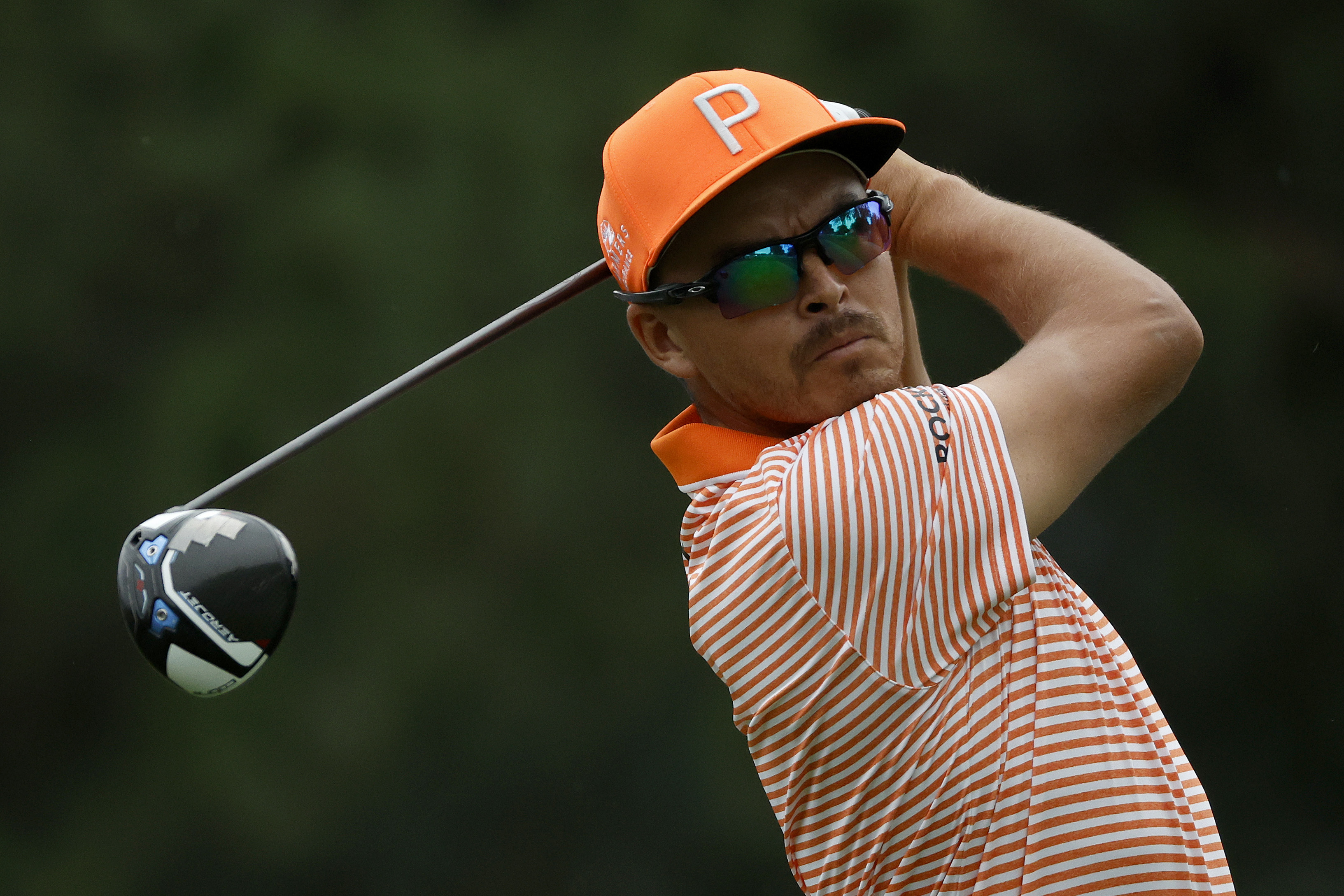 Rickie Fowler holds his finish on a drive