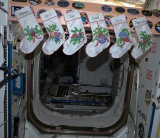 Christmas stockings for the space station's Expedition 34 crewmembers are hung with care.