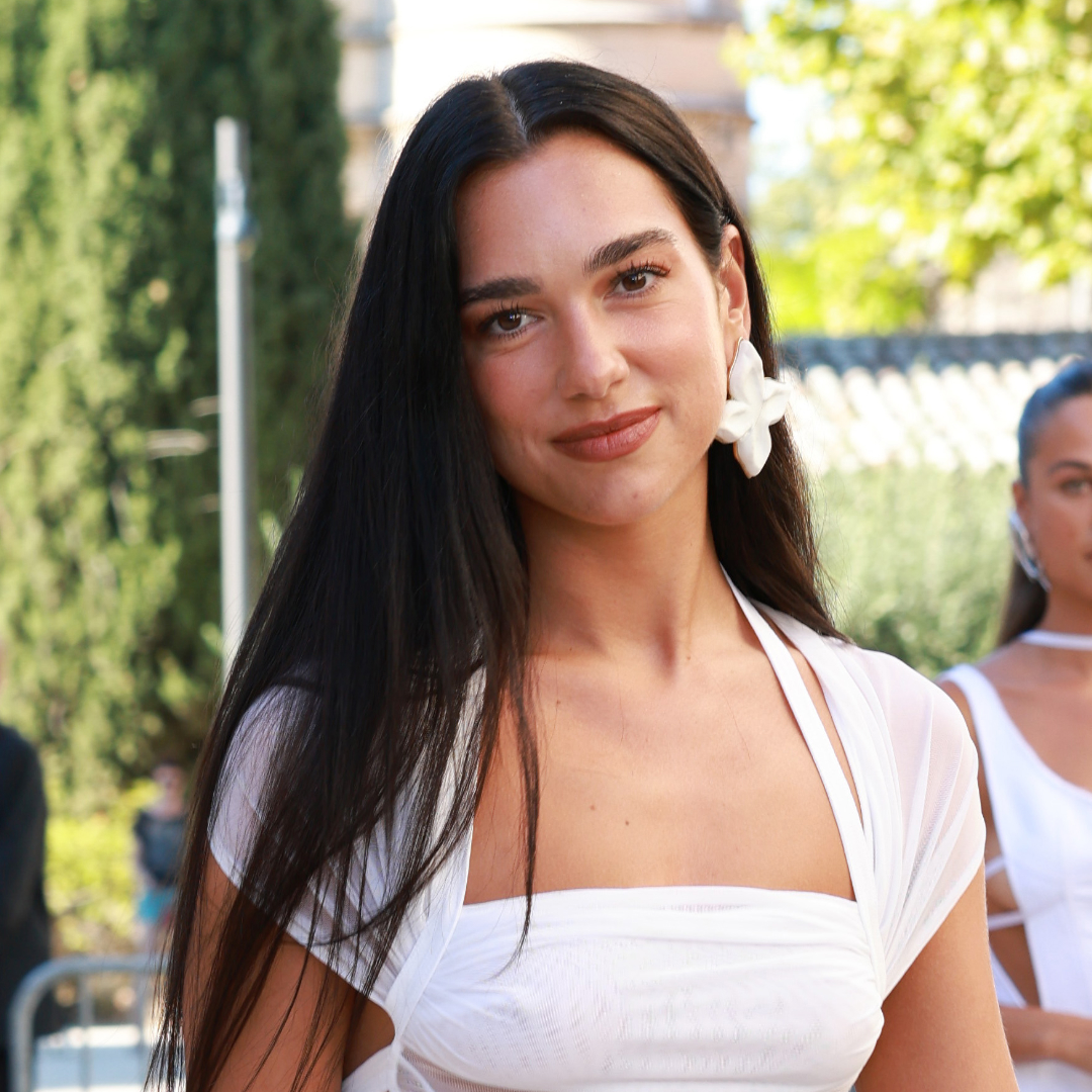 Dua Lipa wearing a white dress