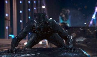 Chadwick Boseman as Black Panther in battle with his Vibranium suit