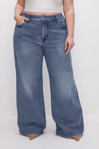 a model wears baggy wide-leg jeans