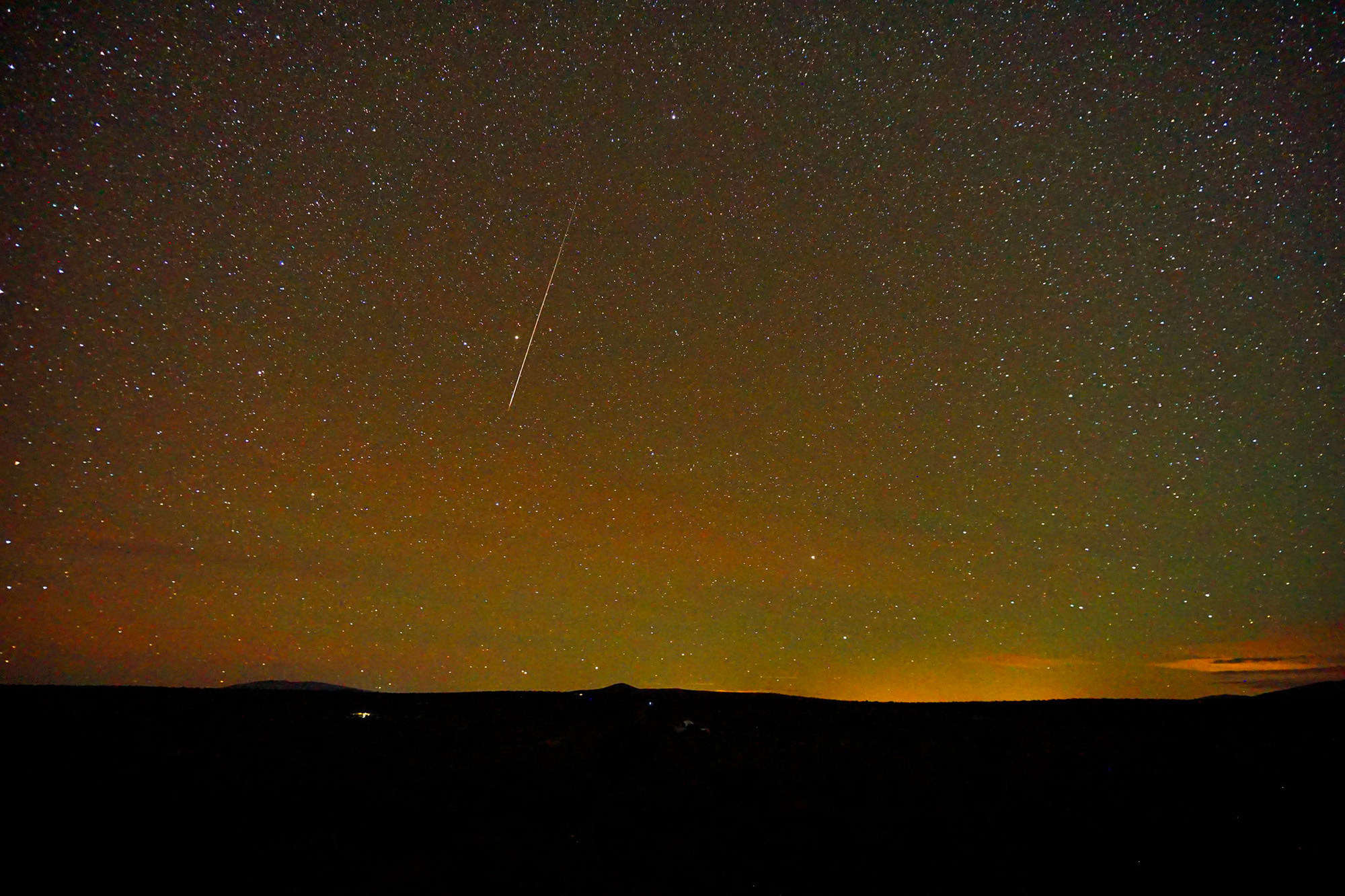 A Drakonid meteor streaks through the starry sky over Taos, New Mexico, in this photo taken by Mike Lewinski on October 5, 2018.