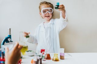 Little girl dressed as a scientist