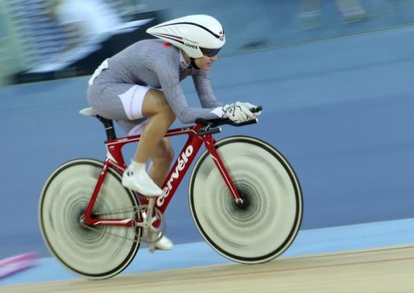 Evgenia Romanyuta rides in the omnium pursuit wearing the world cup leaders jersey