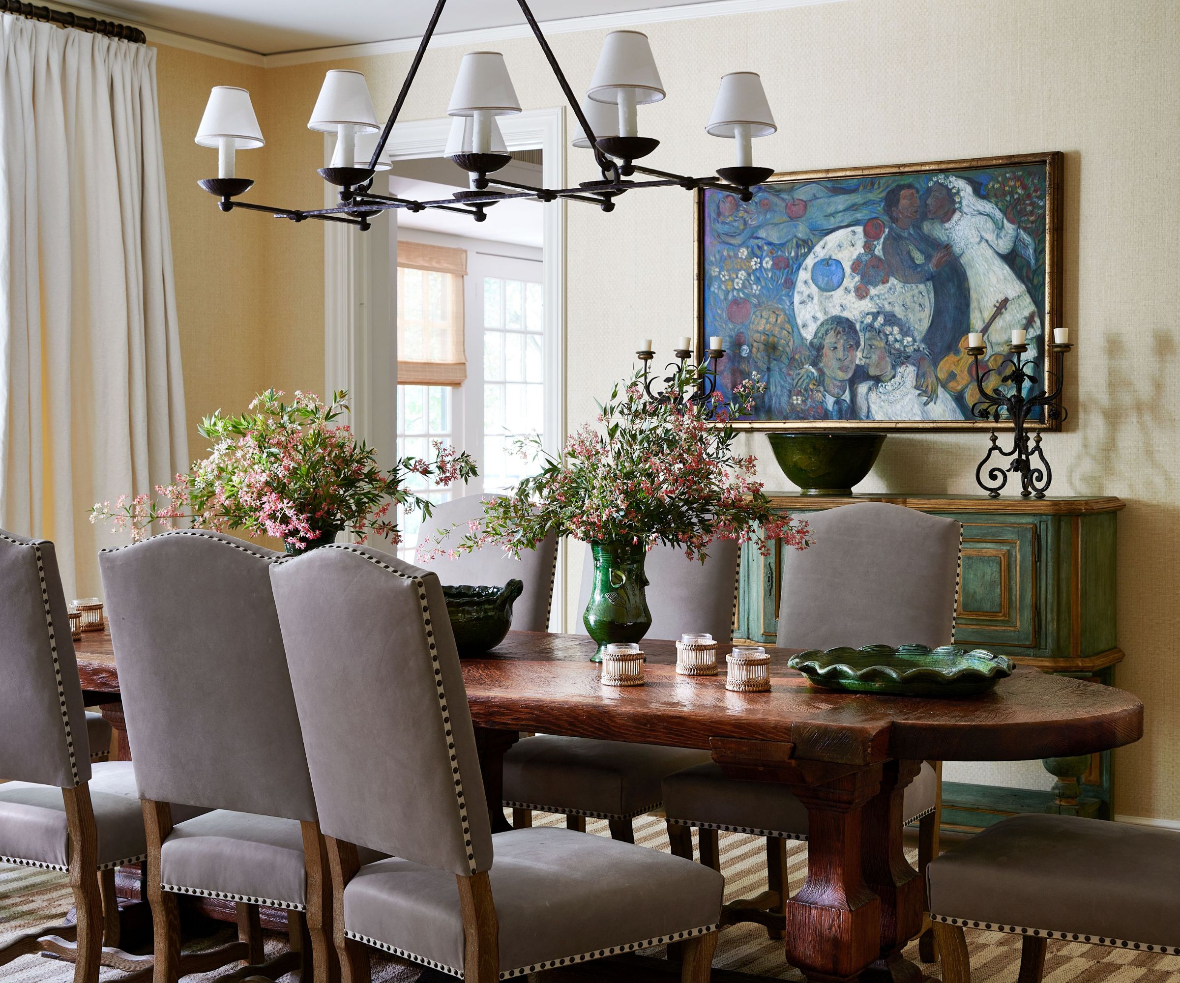 dining room with upholstered chairs and oval dark wood table