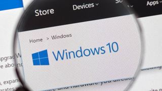Windows 10 logo on screen shown in magnifying glass