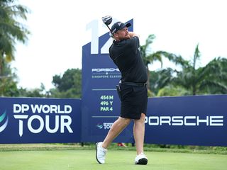 shane lowry hits a tee shot at the singapore Classic