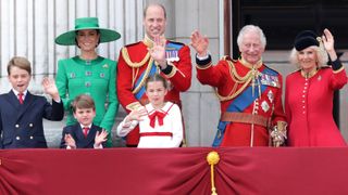 King Charles III and Queen Camilla wave alongside Prince William, Prince of Wales, Prince Louis of Wales, Catherine, Princess of Wales and Prince George of Wales on the Buckingham Palace balcony