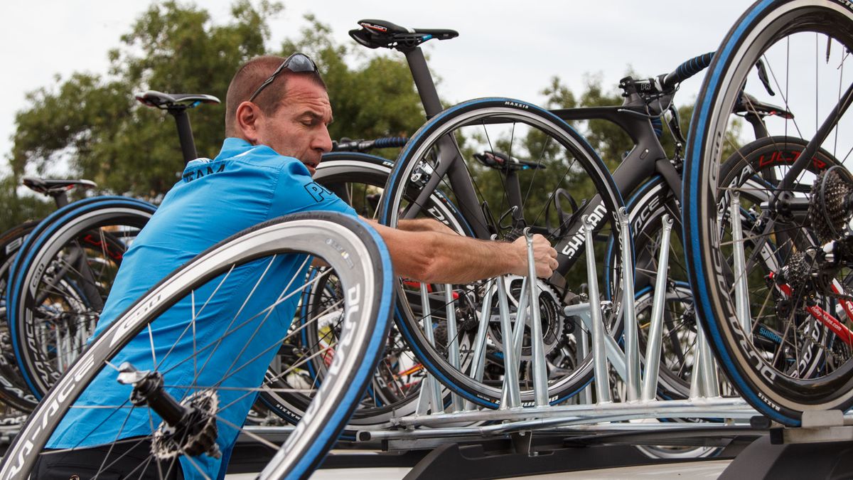 There's already a stack inside the car, but more spare wheels are loaded up amongst the bikes