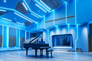Ascentone Studios, Beijing by WSDG, grand piano in blue-lit space