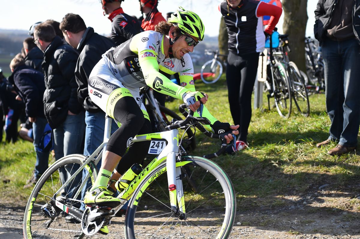 Filippo Pozzato rides over the top of the Paterberg