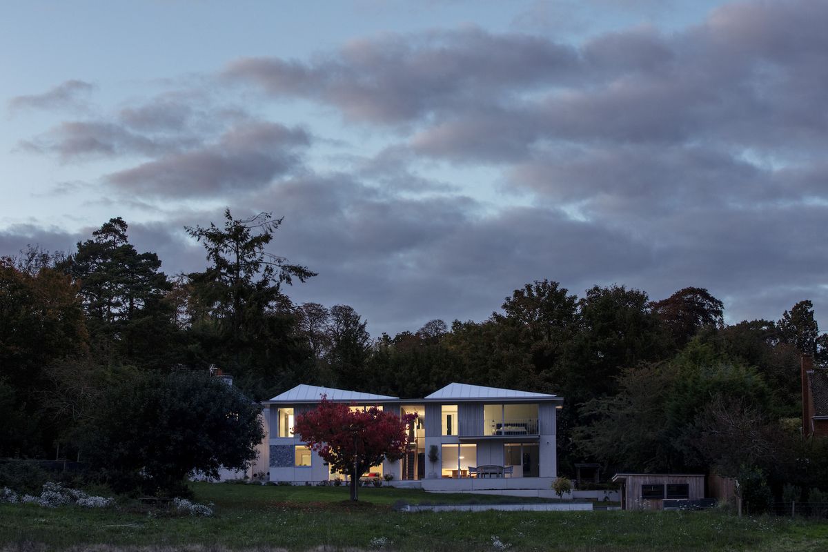 exterior at dusk of modern extension to victorian house