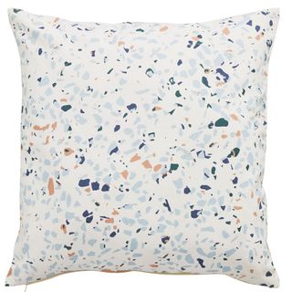 white pillow with multicolour dotted pattern prints