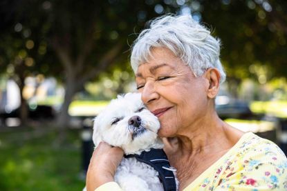 Woman hugging a puppy