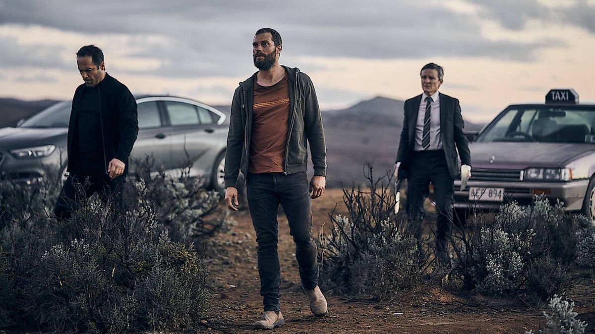 (L-R) Alex Dimitriades as Kosta Panigiris, Jamie Dornan as Elliot, Damon Herriman as DI Lachlan Rogers in The Tourist on Netflix