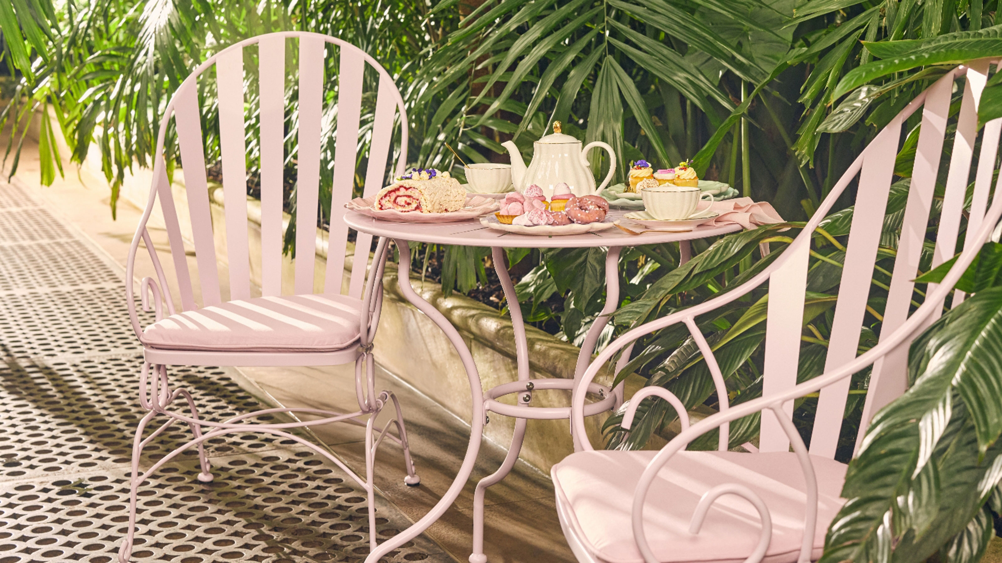 Pink metal bistro set in garden