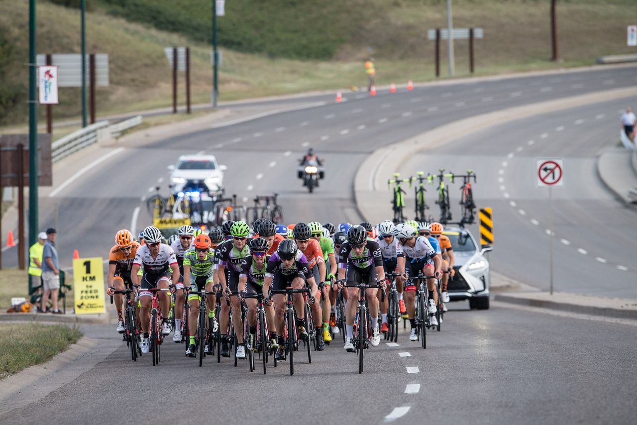 The Lupus team swell to the front of the peloton