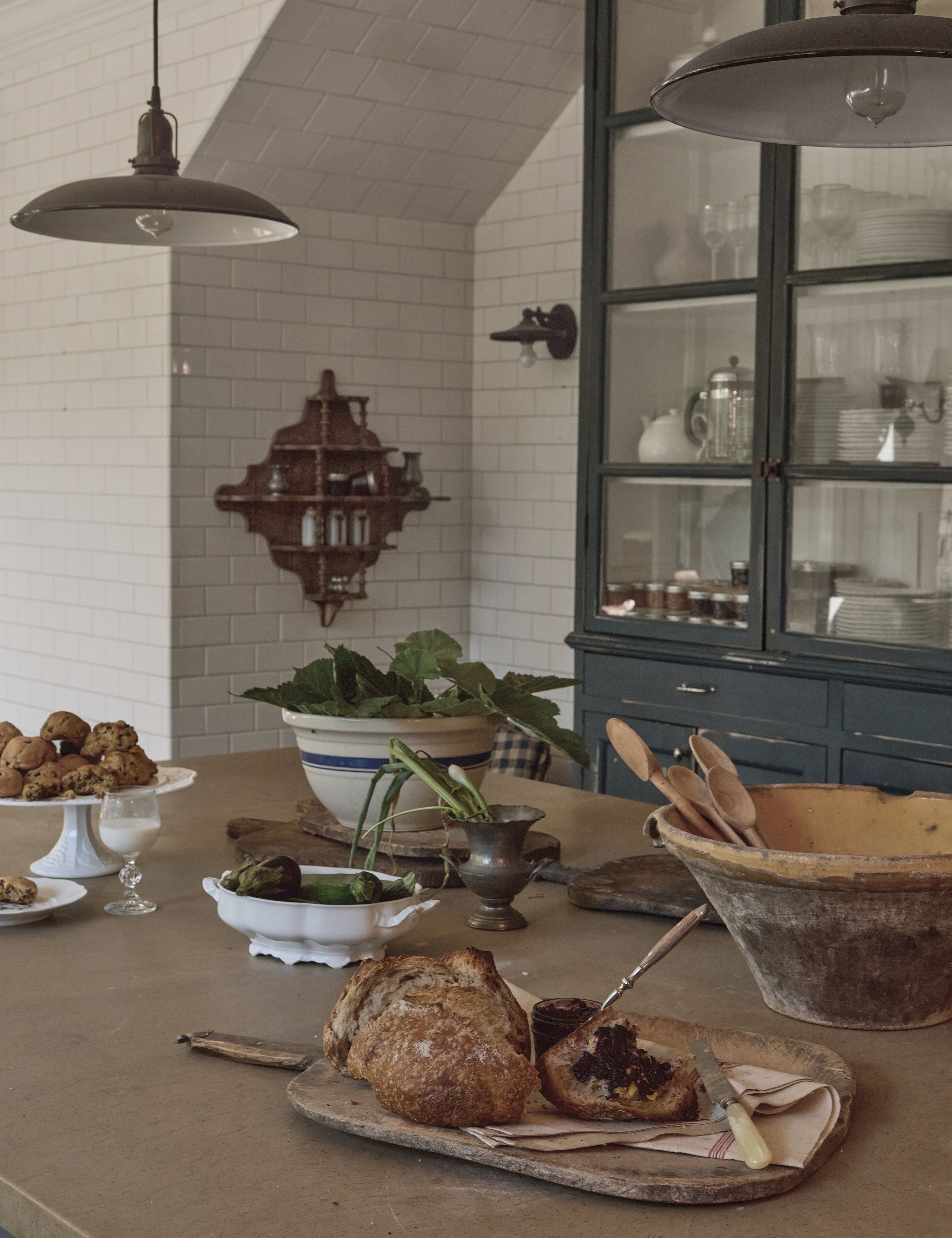 Olive Ateliers antique-inspired tableware styled in a French farmhouse-style kitchen