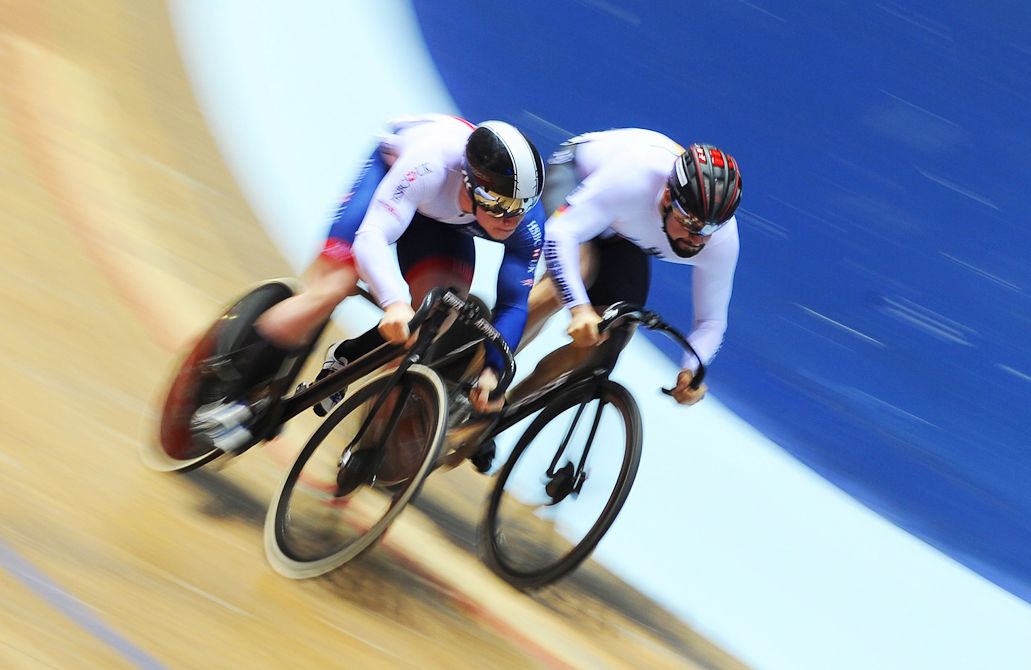 Jack Carlin of Great Britain (L) and Tobias Wachter of Germany compete in the Mens 1/16th Sprint Finals